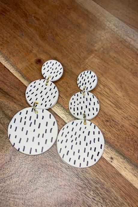 the kendra earrings. cute dotted dangle black and white polymer clay earrings